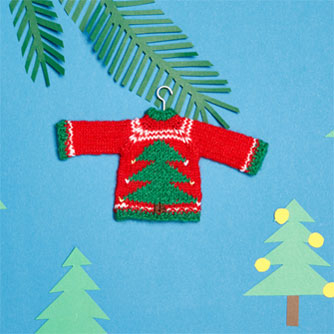 Knitting little Christmas sweaters